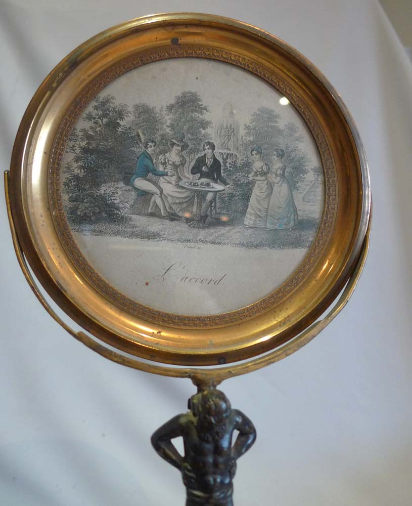 Antique English Regency ormolu swing frame mirror.