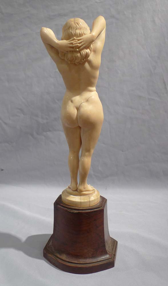 An early 20th century ivory nude on shaped base.