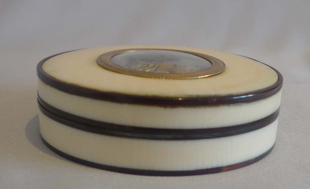Antique George III ivory and tortoiseshell box with apple tree on mother-of-pearl background.
