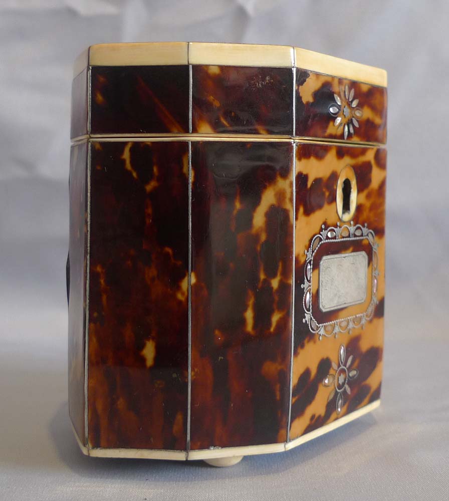Antique tortoiseshell, ivory and shell tea caddy.