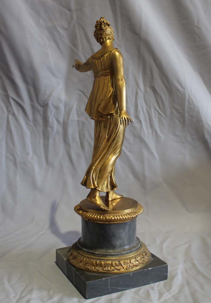 Antique French Louis XVI ormolu statue of a woman on Blue Tarquin ormolu mounted marble base.