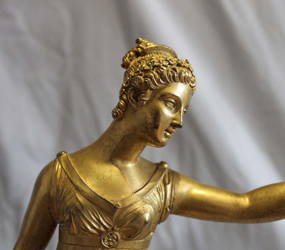 Antique French Louis XVI ormolu statue of a woman on Blue Tarquin ormolu mounted marble base.