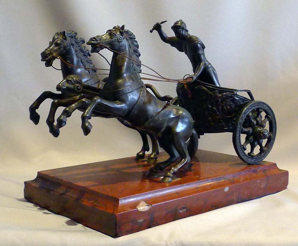 Antique Grand tour bronze of Charioteer on rouge marble base.
