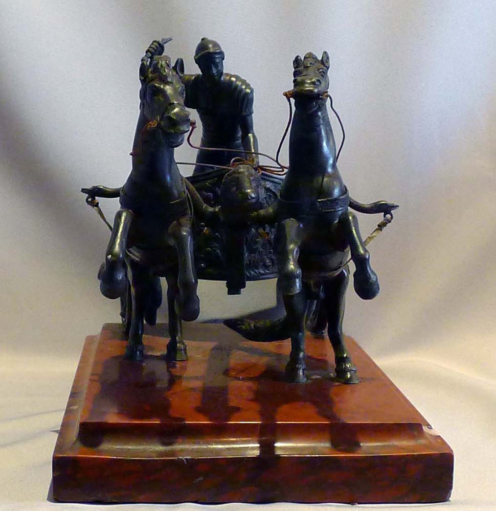 Antique Grand tour bronze of Charioteer on rouge marble base.