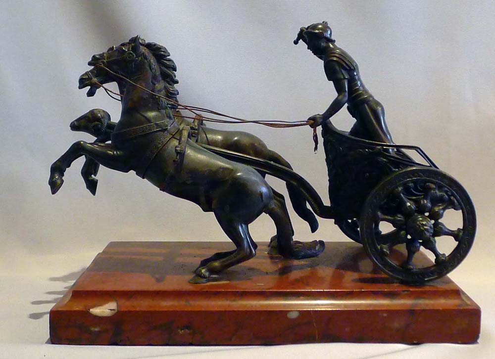 Antique Grand tour bronze of Charioteer on rouge marble base.