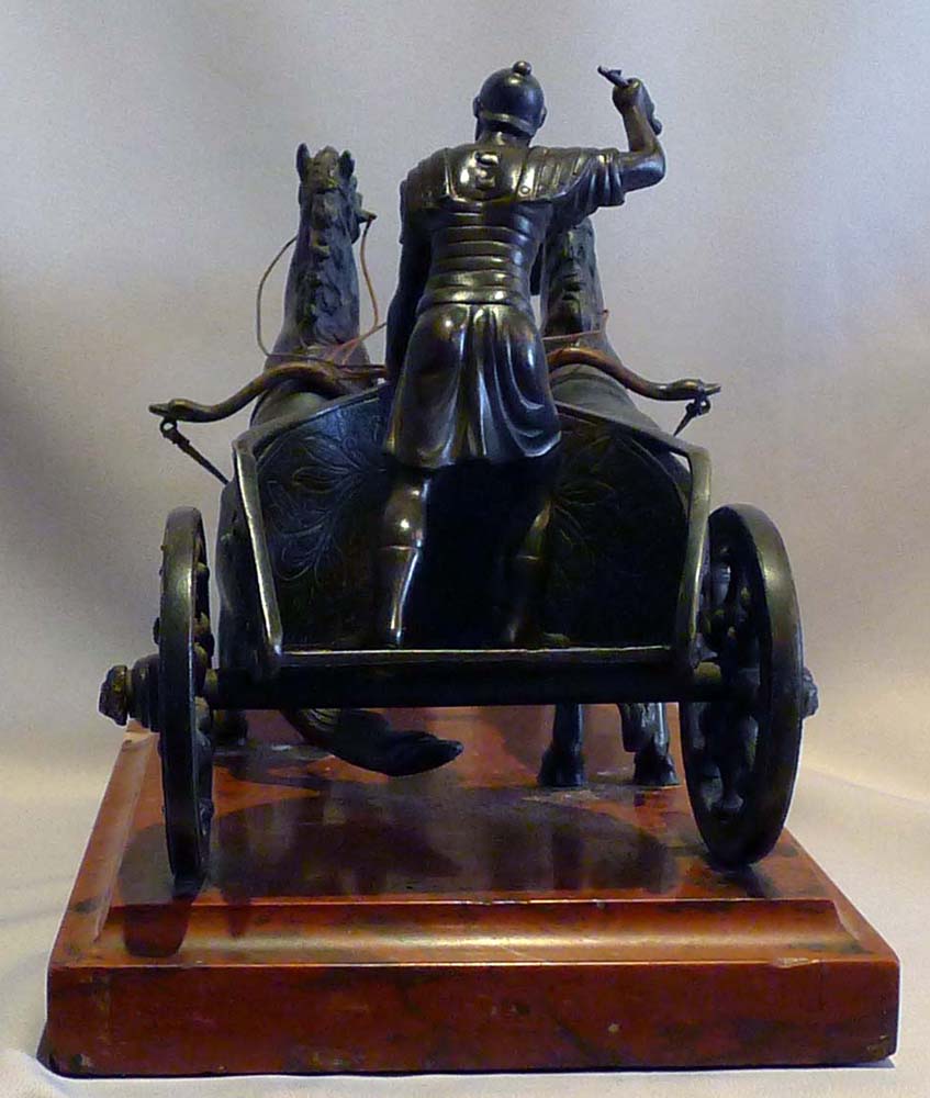Antique Grand tour bronze of Charioteer on rouge marble base.