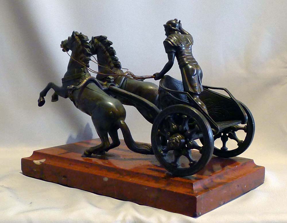 Antique Grand tour bronze of Charioteer on rouge marble base.