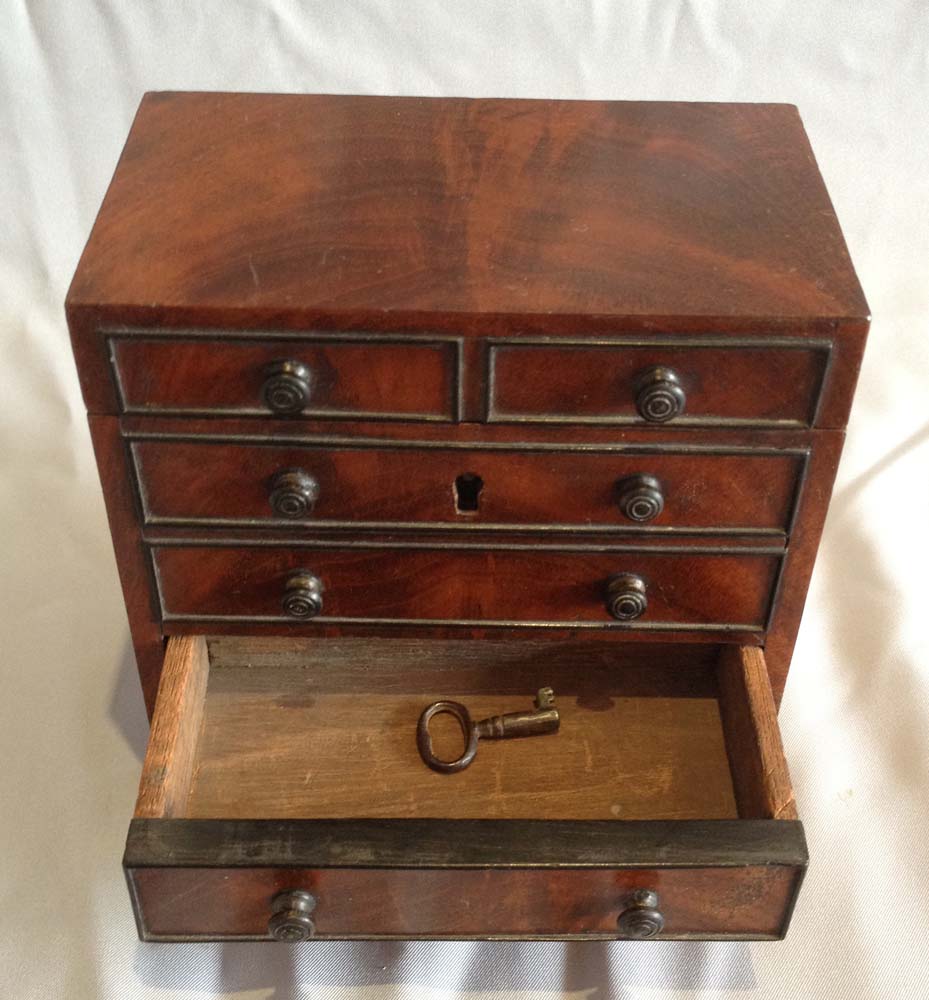 Miniature chest of drawers tea caddy.
