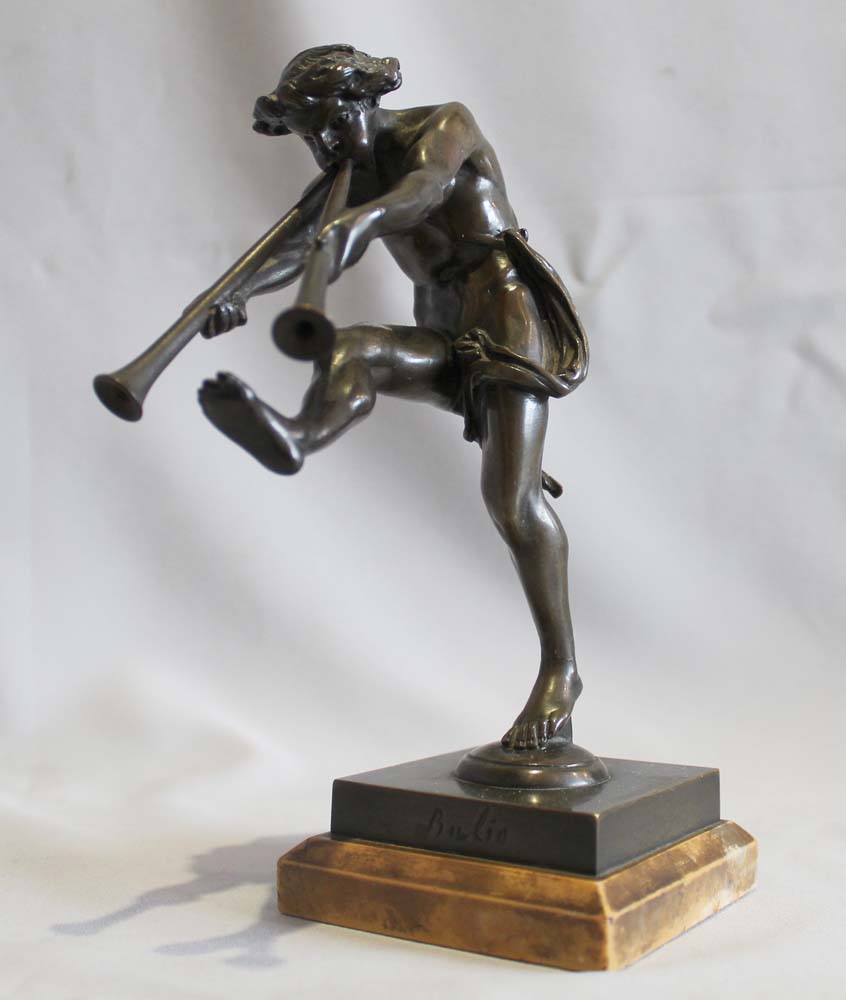Antique bronze of a satyr playing pipes on Sienna marble base signed Bulio.