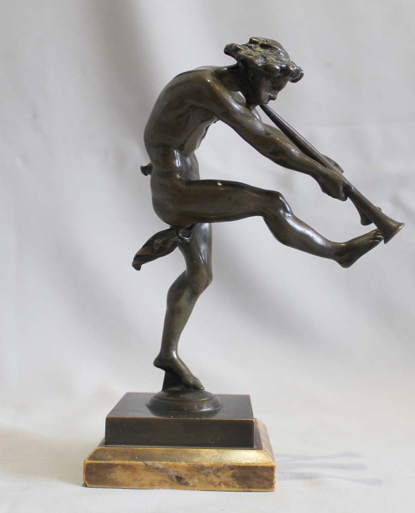 Antique bronze of a satyr playing pipes on Sienna marble base signed Bulio.