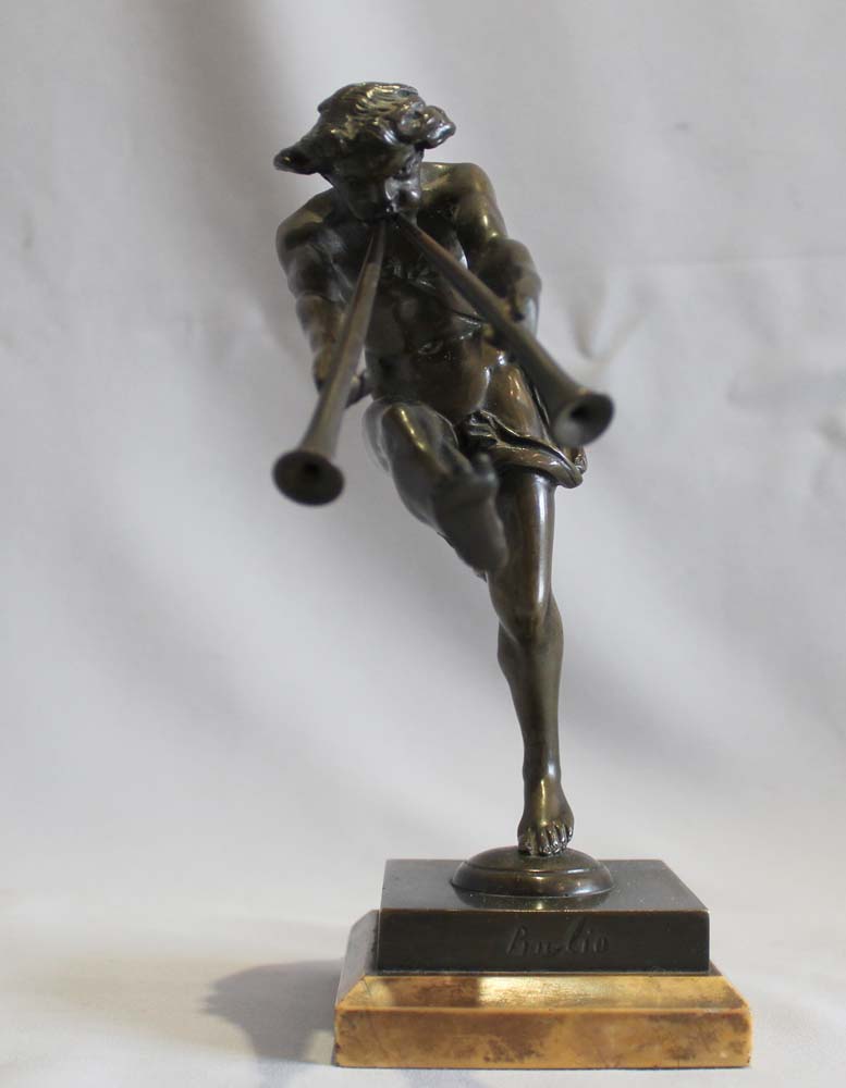 Antique bronze of a satyr playing pipes on Sienna marble base signed Bulio.