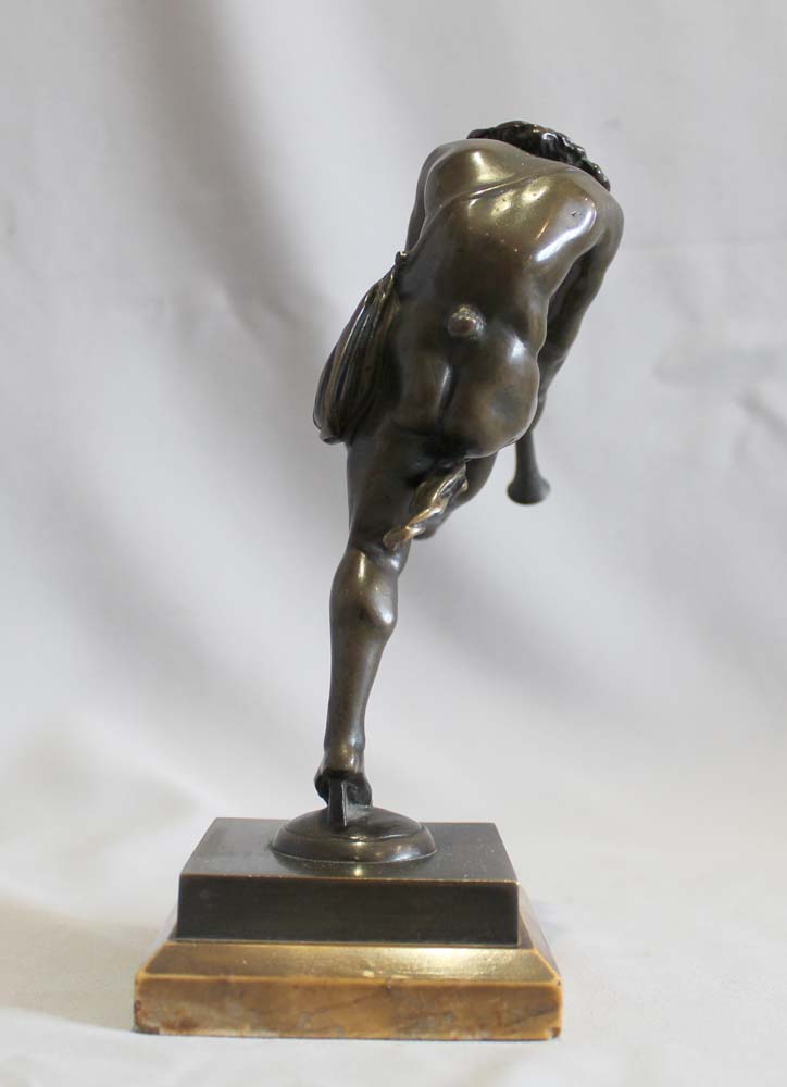 Antique bronze of a satyr playing pipes on Sienna marble base signed Bulio.