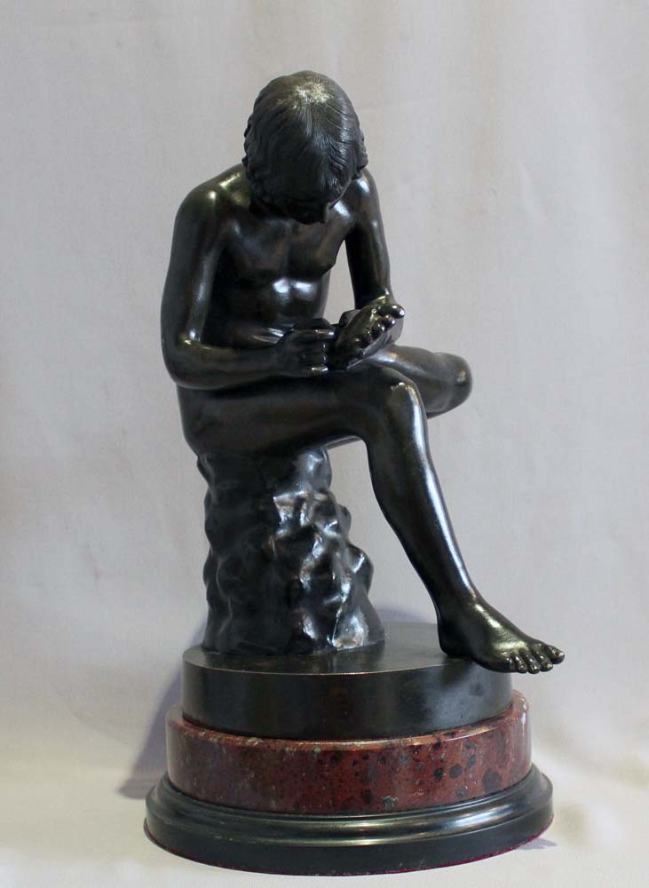 Antique Italian Grand Tour bronze of the Spinario on rouge marble base.