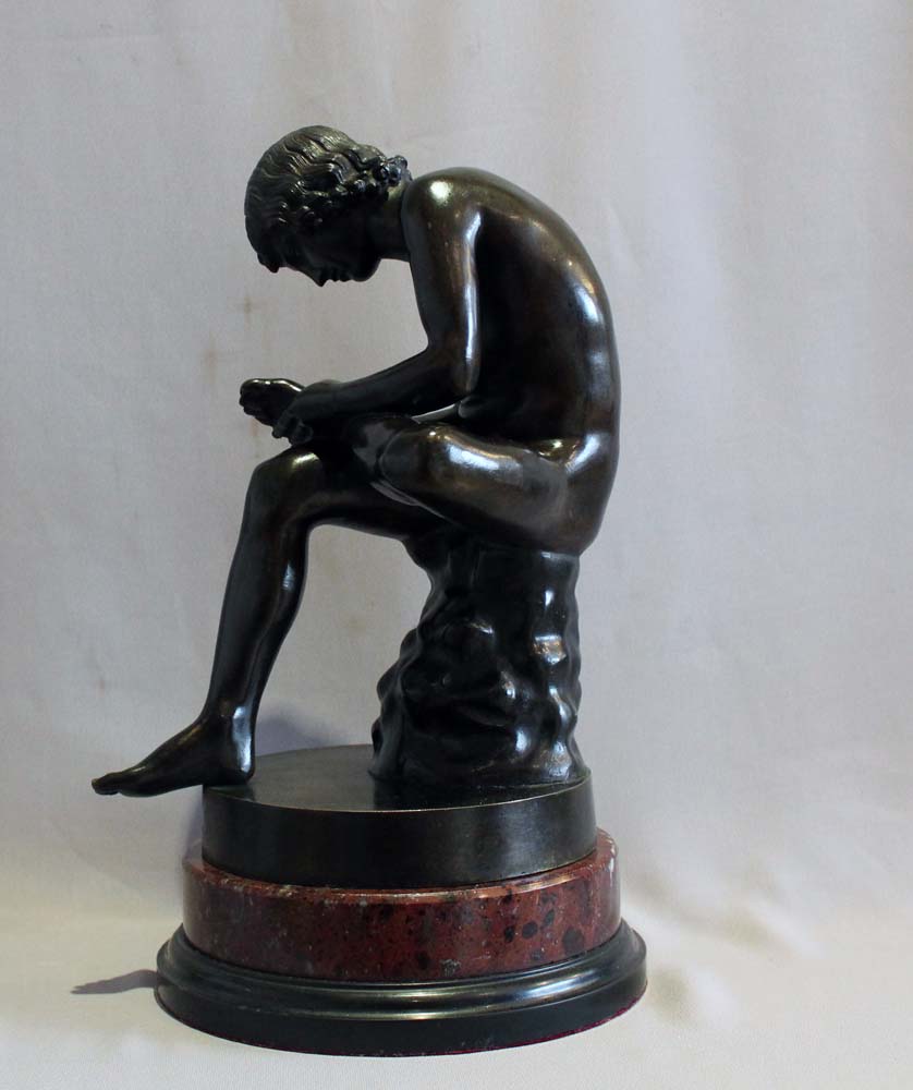 Antique Italian Grand Tour bronze of the Spinario on rouge marble base.
