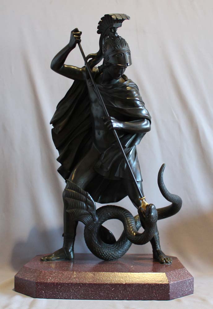 Antique bronze of Jason fighting the dragon for the golden fleece.