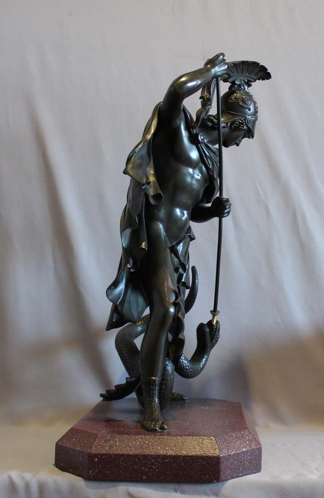 Antique bronze of Jason fighting the dragon for the golden fleece.