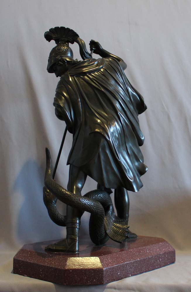 Antique bronze of Jason fighting the dragon for the golden fleece.
