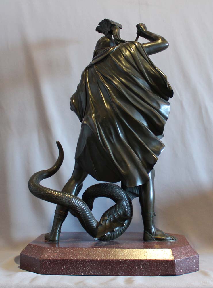 Antique bronze of Jason fighting the dragon for the golden fleece.