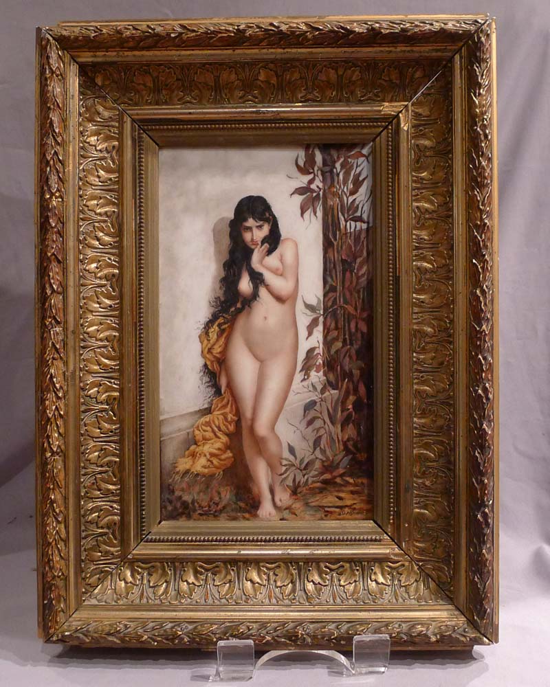 Antique continental framed porcelain plaque of naked young woman.