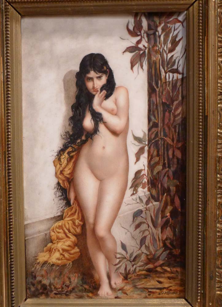 Antique continental framed porcelain plaque of naked young woman.