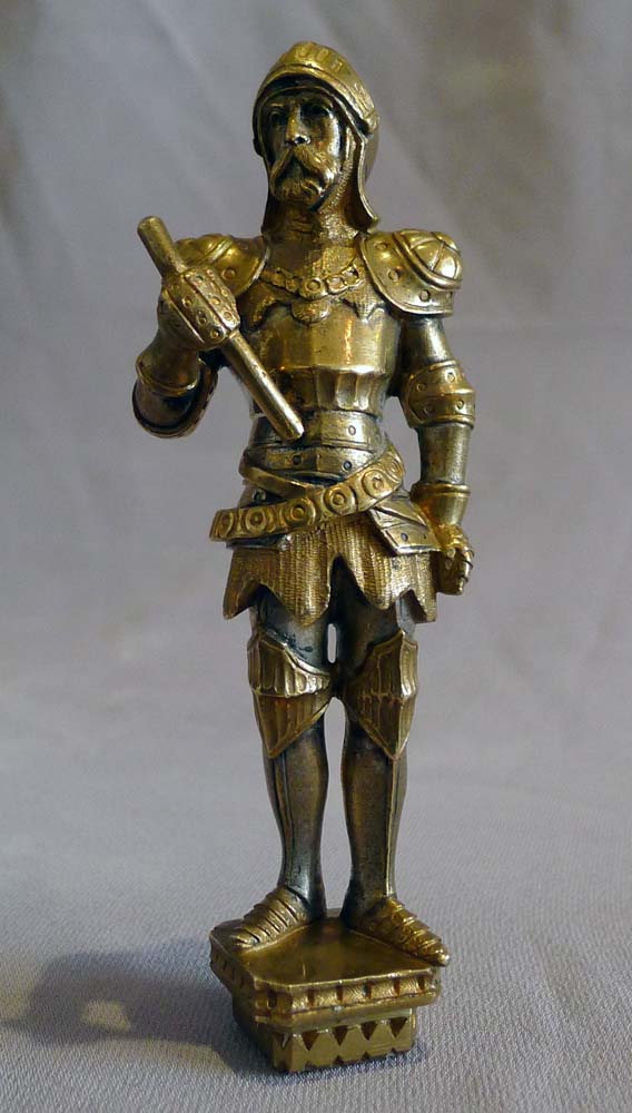 Antique seal in the form of a standing knight in full armour.