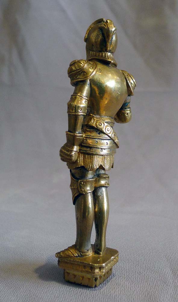 Antique seal in the form of a standing knight in full armour.