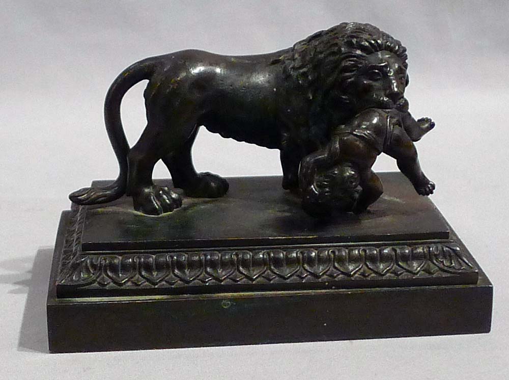 Antique English Regency bronze of Lion with child.