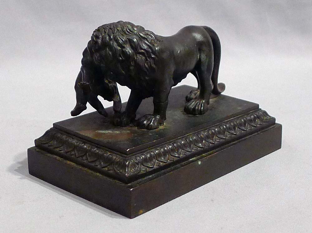 Antique English Regency bronze of Lion with child.