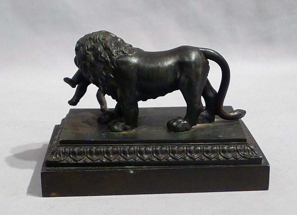 Antique English Regency bronze of Lion with child.