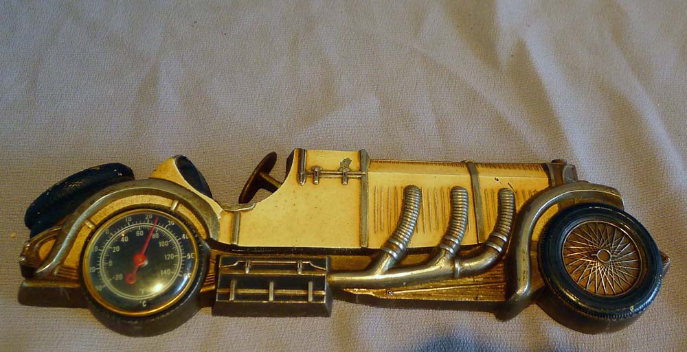 Vintage tin plate classic sports car thermometer.