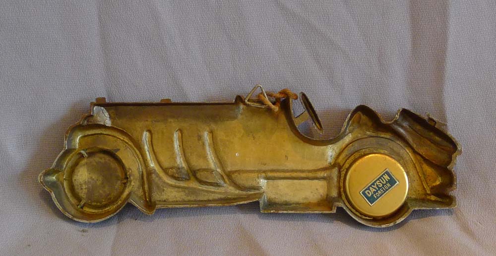 Vintage tin plate classic sports car thermometer.