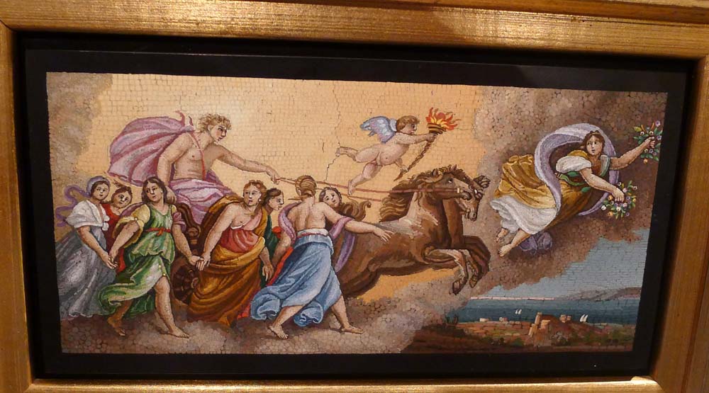 Fine antique Italian mosaic on to black marble in giltwood frame.