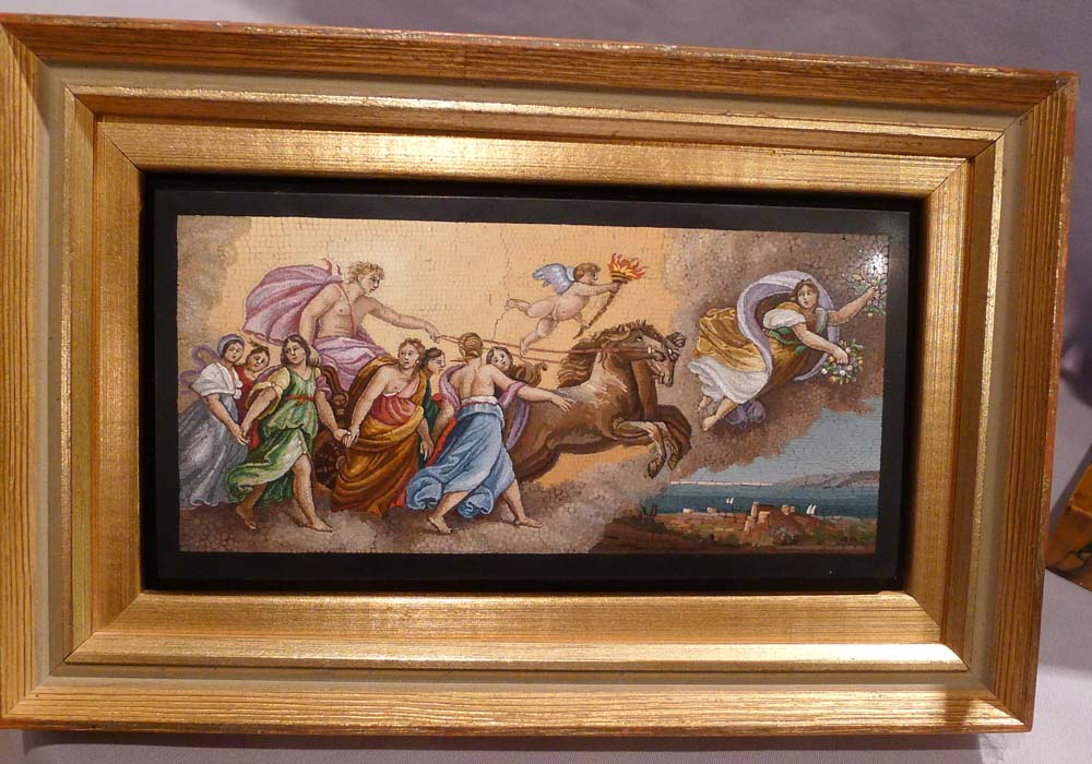 Fine antique Italian mosaic on to black marble in giltwood frame.