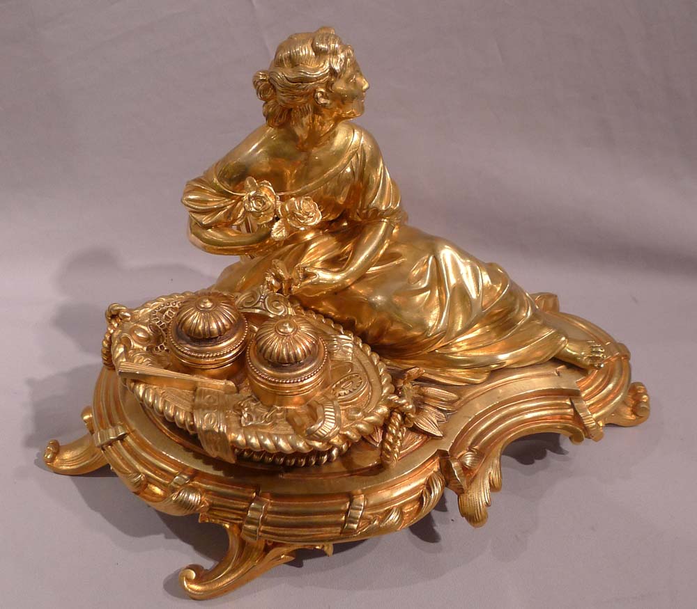 Antique gilt bronze desk standish with a reclining lady.