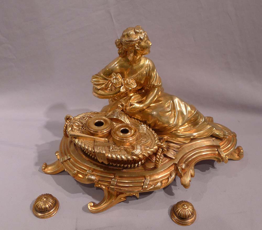 Antique gilt bronze desk standish with a reclining lady.