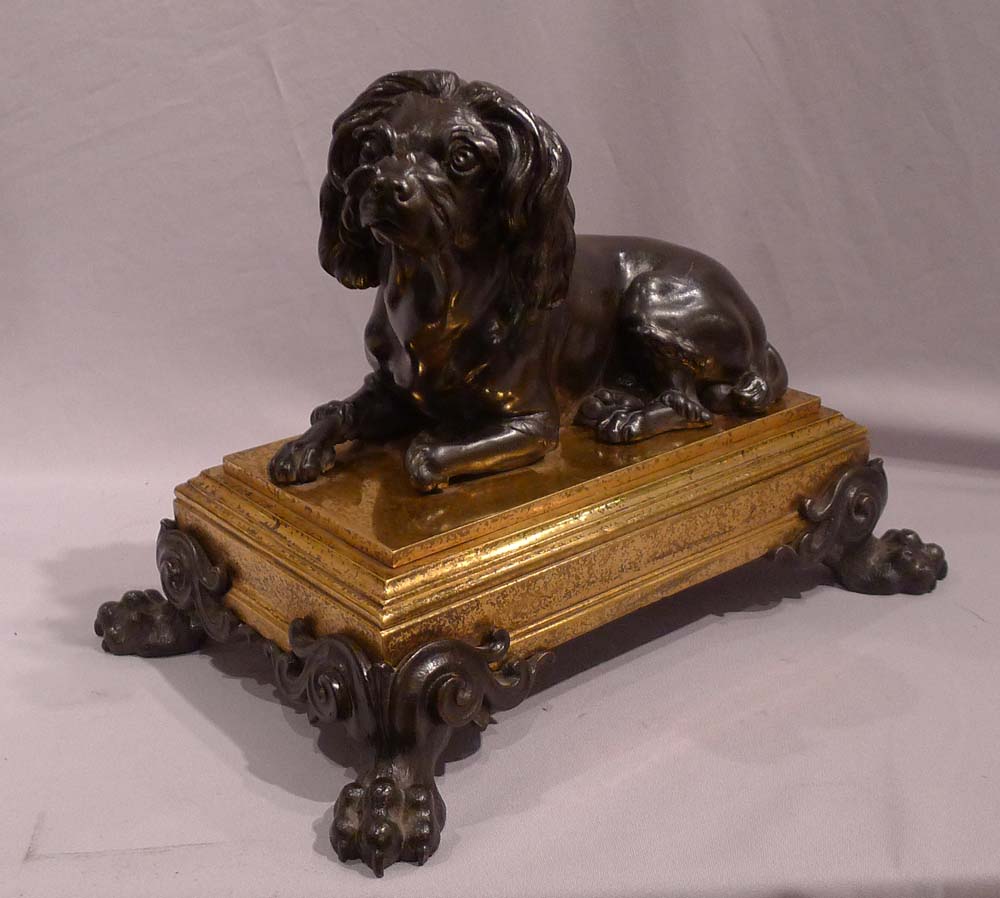 Antique French bronze of dog on ormolu base in manner of Caffieri.