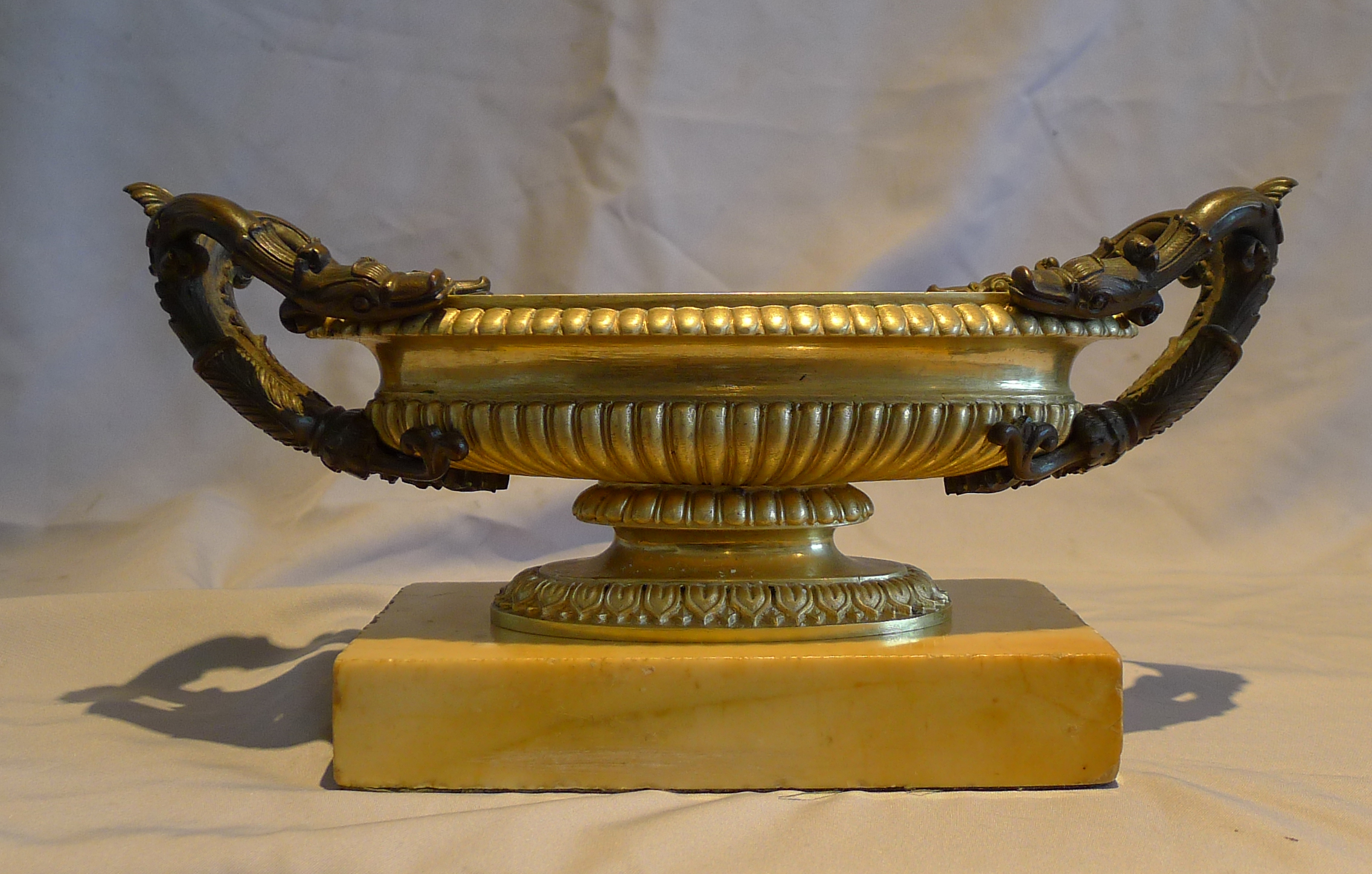 Antique Italian Grand Tour pair of patinated and gilt bronze tazza set on a Sienna marble base.