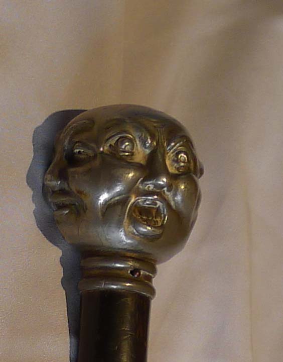 Antique page turner ebonizes and silvered with four faces.