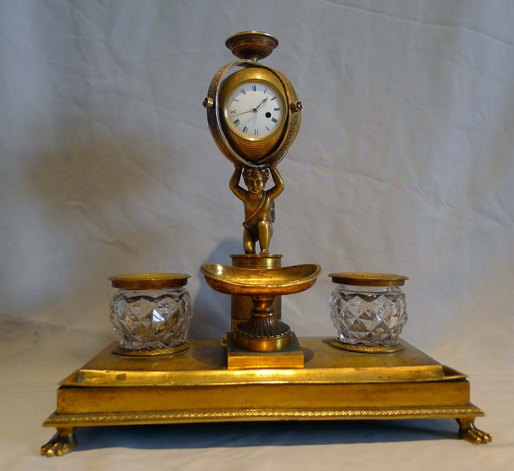 English Regency ormolu inkstand with watch movement circa 1815.