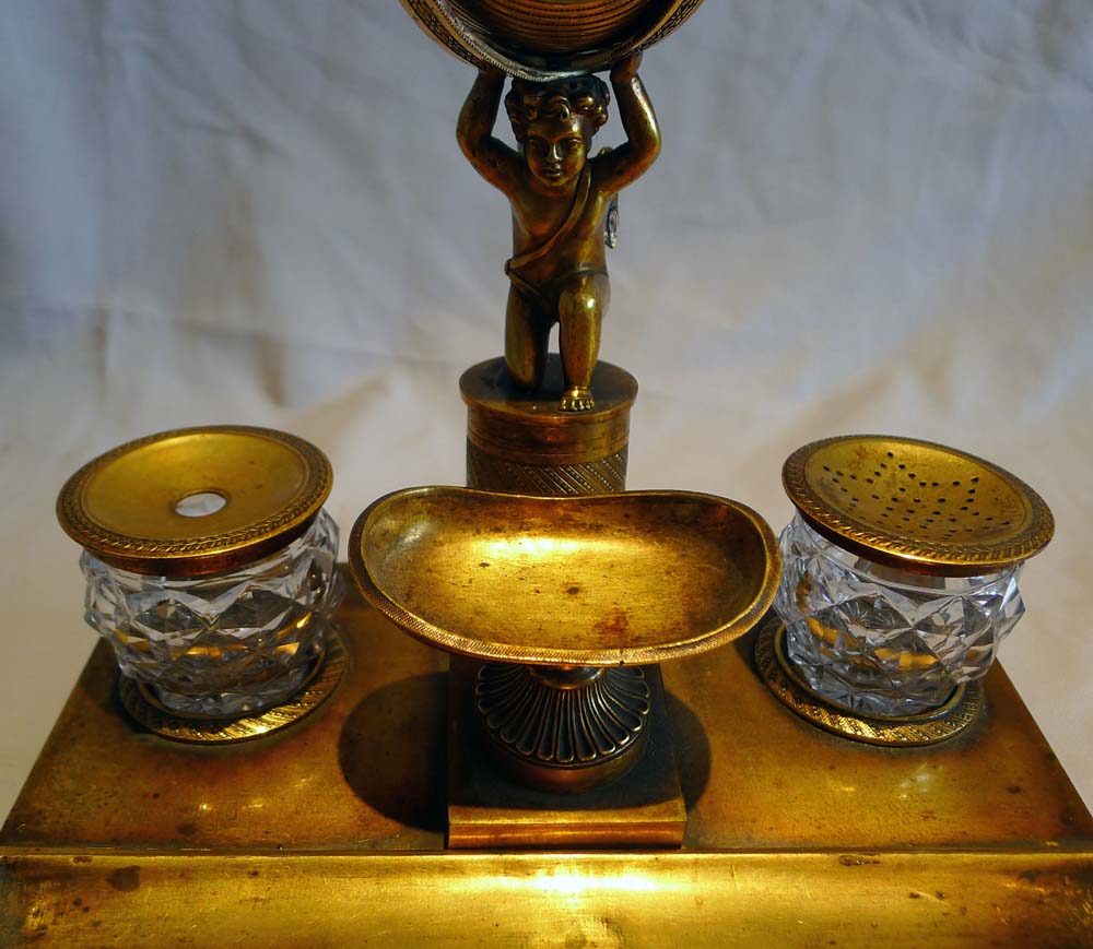 English Regency ormolu inkstand with watch movement circa 1815.