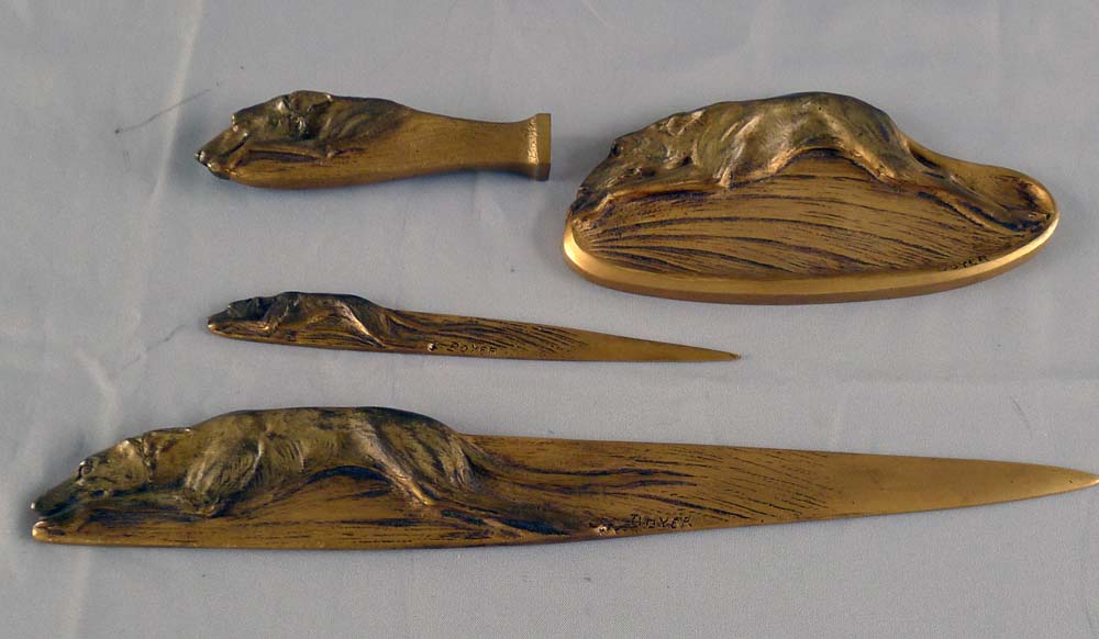 Boxed bronze greyhound desk set of seal, pintray and two letter openers signed Boyer.