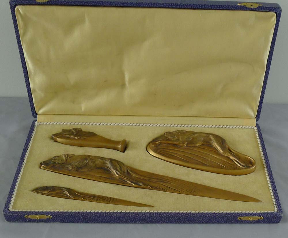 Boxed bronze greyhound desk set of seal, pintray and two letter openers signed Boyer.