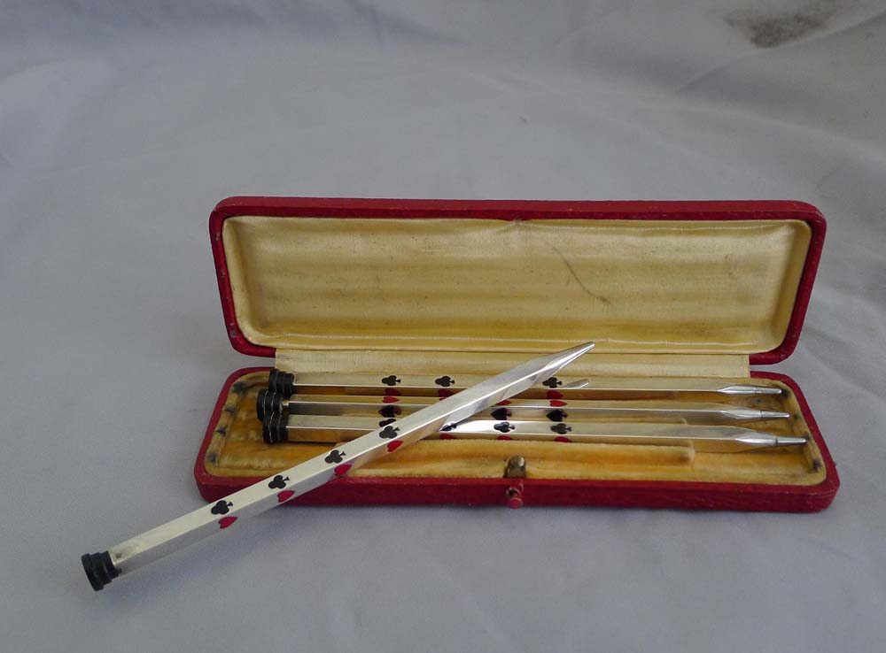 A cased set of silver and enamel Bridge Propelling pencils.