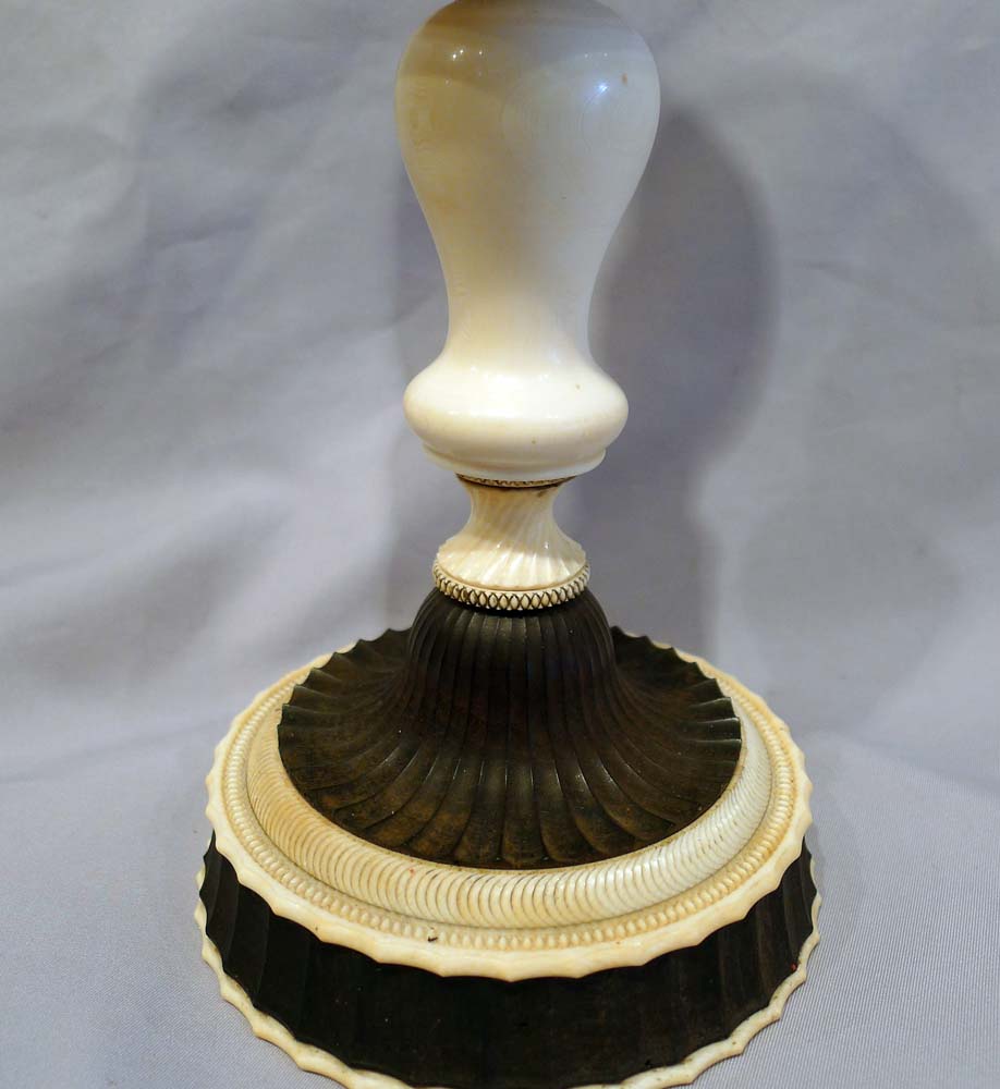 Antique ivory cup on stand.