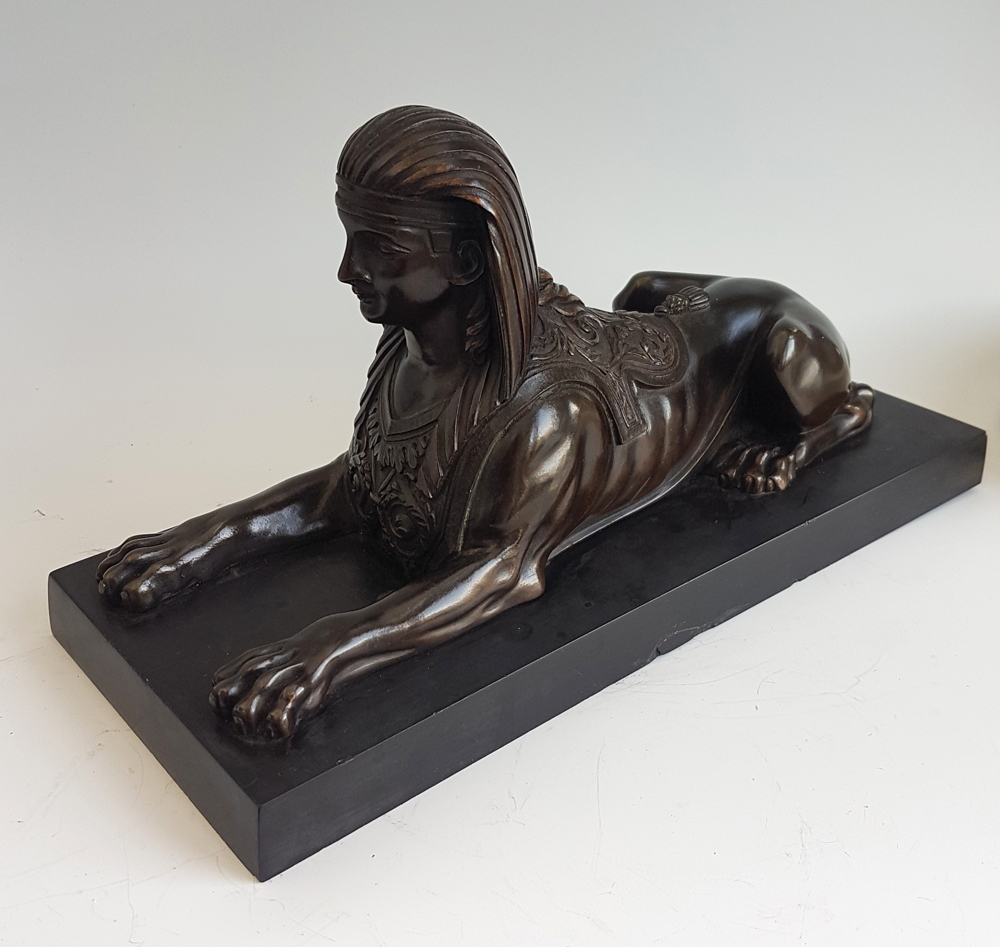English Regency Egyptian revival Sphinx on black marble base.