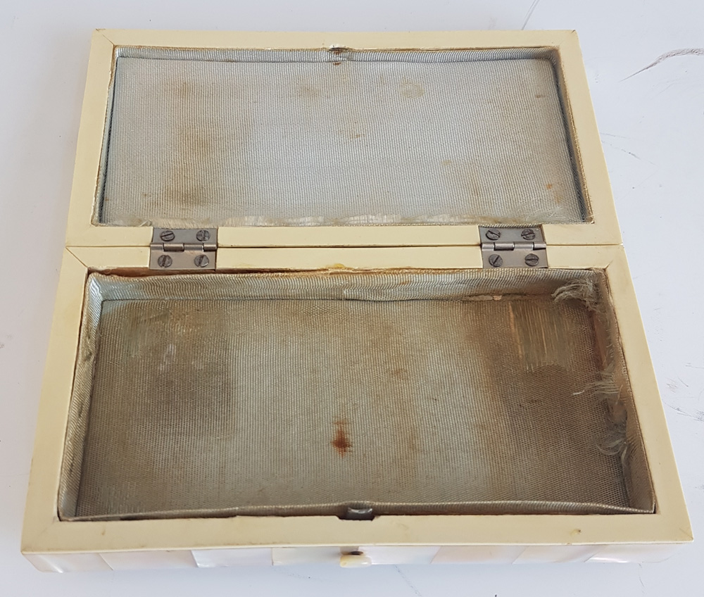 Antique French Napoleon III mother of pearl box with ivory stringing and bun feet.