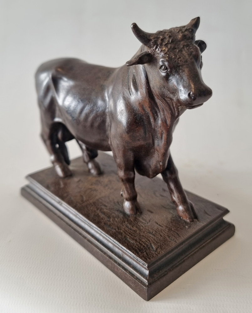 A Patinated Iron Sculpture of a Bull