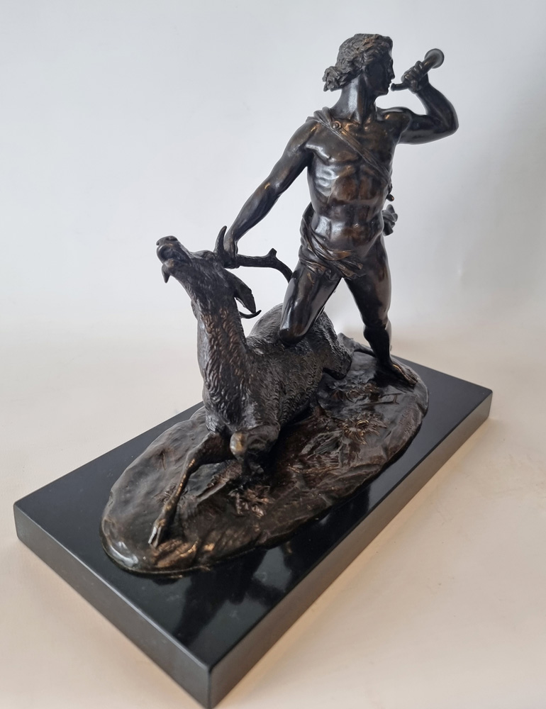 Antique Patinated Bronze  model of a huntsman and a stag by Holme Cardwell