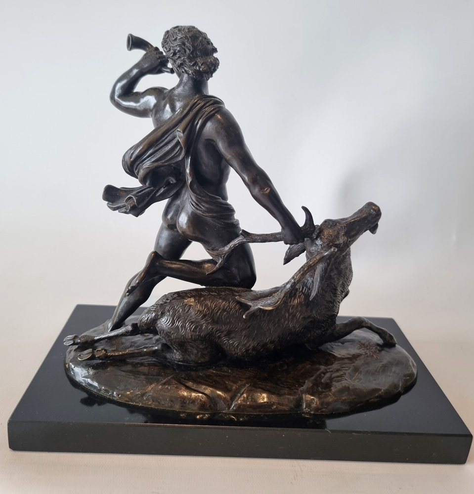 Antique Patinated Bronze  model of a huntsman and a stag by Holme Cardwell