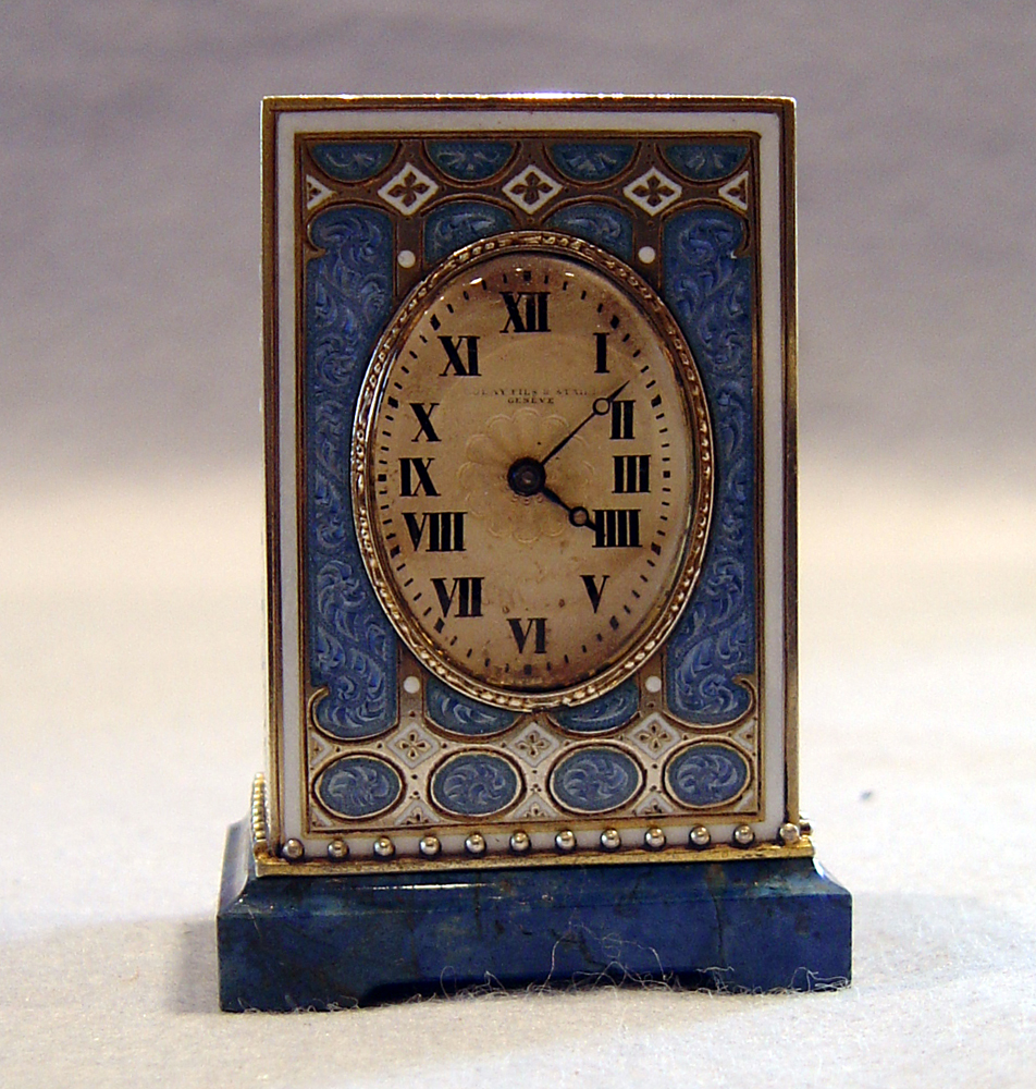 Cased  silver gilt, blue guilloche enamel, jewelled and lapis Lazuli carriage clock.